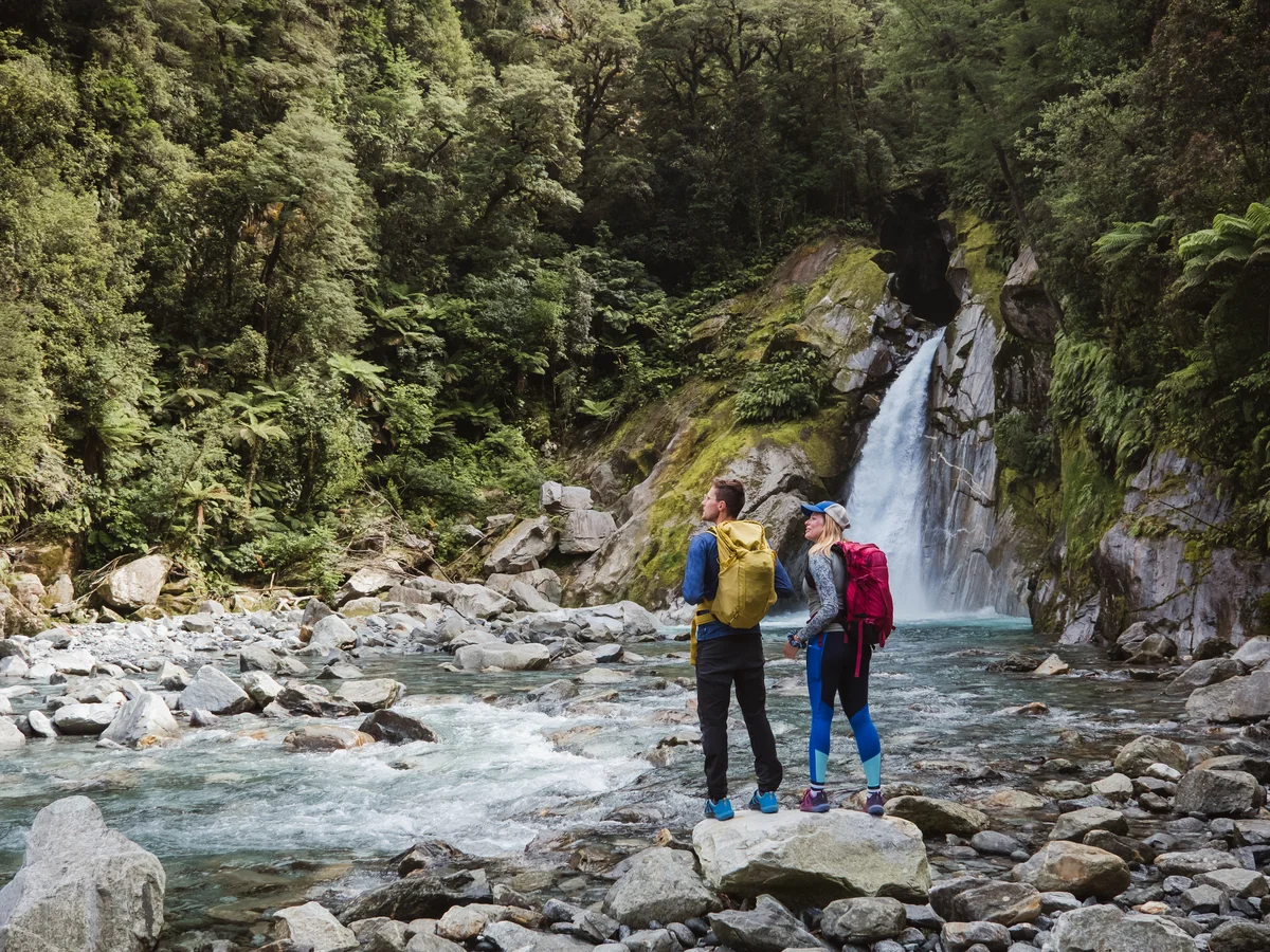 Hikers at Giant Gate Falls, Milford Track